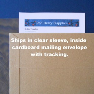 May include: A brown cardboard mailing envelope with a white label that says "Ships in clear sleeve, inside cardboard mailing envelope with tracking."