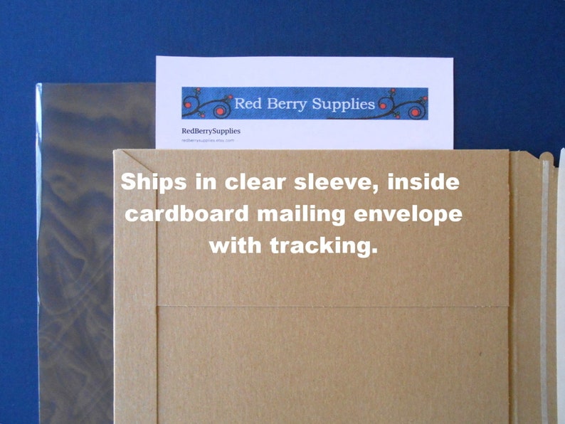 May include: A brown cardboard mailing envelope with a white label that says "Ships in clear sleeve, inside cardboard mailing envelope with tracking."