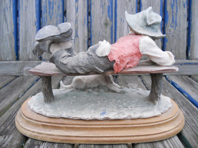 capodimonte tramp on bench with dog