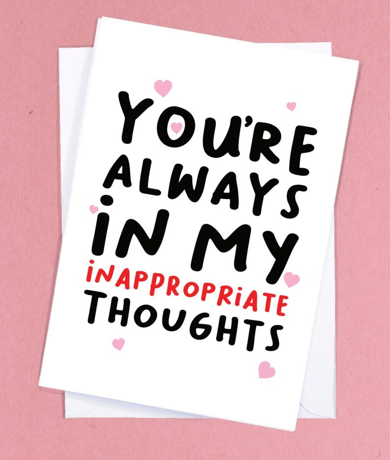 May include: White card with black text that reads "You're always in my inappropriate thoughts."  There are small pink hearts scattered around the text.