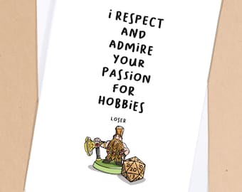 May include: A white card with black text that reads "I respect and admire your passion for hobbies."  The word "loser" is written below the text. A cartoon illustration of a dwarf with a beard and a hat holding an axe and a 20-sided die is below the text.