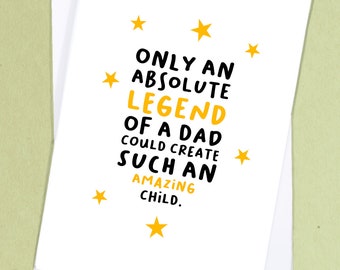 May include: A white card with black and yellow text that reads "Only an absolute legend of a dad could create such an amazing child." There are yellow stars scattered around the text.