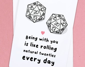 May include: A white card with a black heart and two black and white dice with the number 20 on each. The text on the card reads "Being with you is like rolling natural twenties every day."