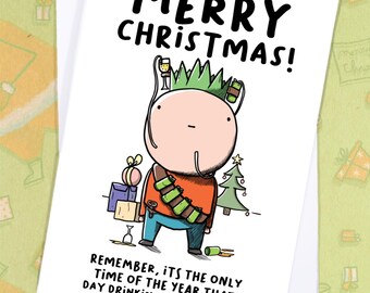 May include: A white Christmas card with the words "MERRY CHRISTMAS!" in large black letters. The card features a cartoon character wearing a crown and holding a champagne glass. The text below reads, "REMEMBER, ITS THE ONLY TIME OF THE YEAR THAT DAY DRINKING IS ACCEPTABLE."