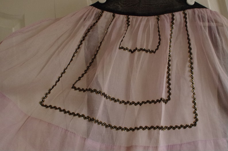 Vintage Half Apron Midcentury Sheer Fancy Hostess Pink Lavender Orchid with black and gold rickrack embellishment trim
