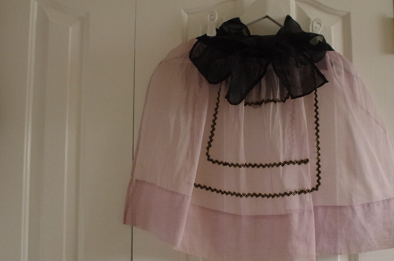 Vintage Half Apron Midcentury Sheer Fancy Hostess Pink Lavender Orchid with black and gold rickrack embellishment trim