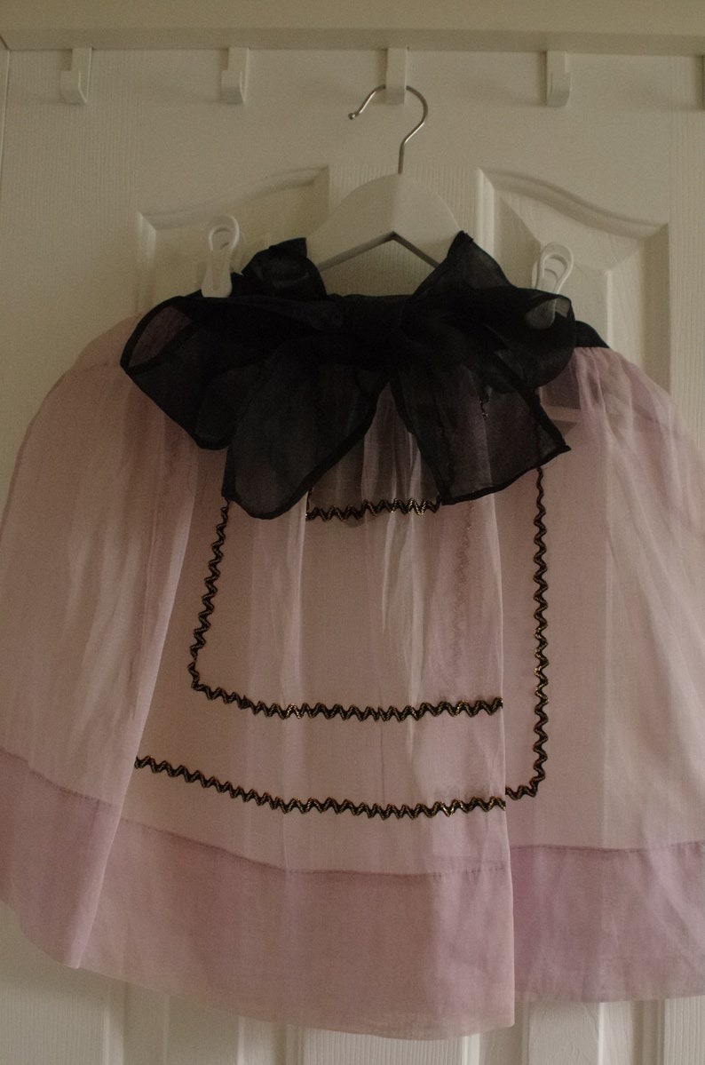 Vintage Half Apron Midcentury Sheer Fancy Hostess Pink Lavender Orchid with black and gold rickrack embellishment trim