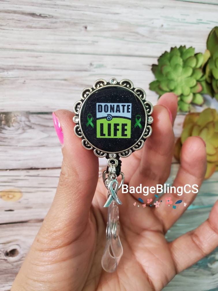 Donate badge reel clip Blue and green donor awareness holder, please donate  tradução