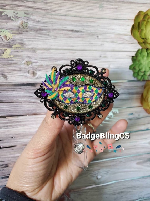 Mardi Gras mask badge reel holder clip New Orleans jewelry Fat Tuesday parade March lent green purple gold beads Fleur-de-lis french quarter
