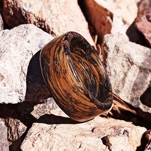 Limited Edition Tennessee Whiskey Barrel Ring photographed in natural light.