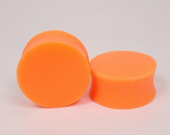Orange Leopard Star Hollow Double Flared Plugs Sold as Pairs Orange Leopard Star Hollow Double Flared Plugs Sold as Pairs