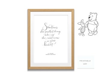 May include: A printable art print featuring a quote from Winnie the Pooh by A.A. Milne. The quote reads "Sometimes the smallest things take up the most room in your heart." The print is framed in a light wood frame and features a black and white illustration of Winnie the Pooh and Piglet.