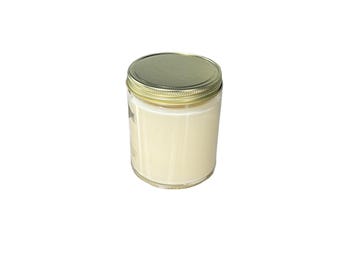 May include: A cylindrical glass jar filled with an opaque, off-white substance, topped with a metallic gold-colored screw-top lid. The container features smooth, clear glass walls that reveal the creamy, light-colored contents inside.