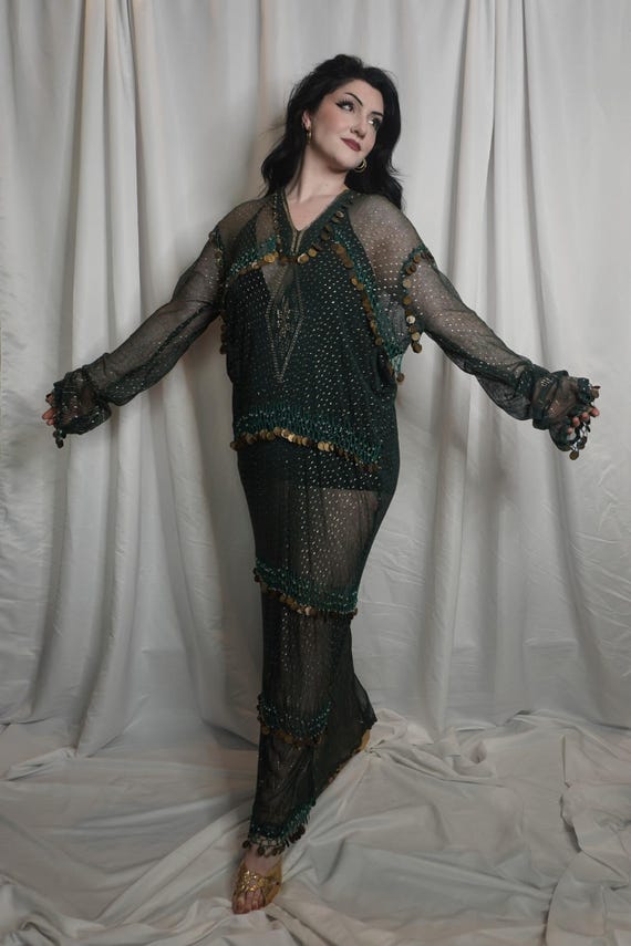 Vintage Green Dress Made of Assuit Fabric & Antique Old Coins Decorate The Edges And In Rows Around The Dress. And This Is The Soft Assuit.