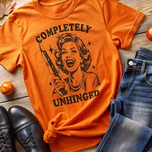 Complete Unhinged Retro Distressed Graphic Tee - Vintage Smiling Female with Sharp Knife Design Unisex Softstyle T-Shirt