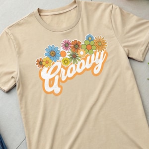 Camiseta vintage de algodão pesado unissex com estampa de flores retrô dos anos 60 e estampa desgastada