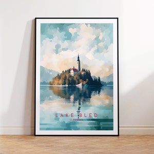 May include: A watercolour painting of Lake Bled in Slovenia. The painting depicts a small island with a church on it, surrounded by water and mountains. The sky is a light blue with white clouds.