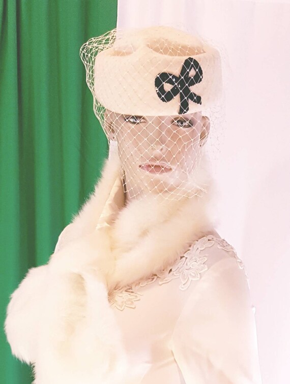 Beige pillbox birdcage felt hat
