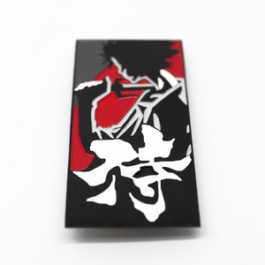 May include: Black and red enamel pin featuring a stylized silhouette of a person with spiky hair and the Japanese word "Bang" in white.