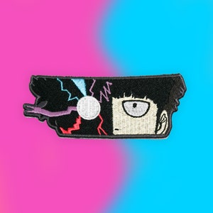 May include: Embroidered patch featuring a black and white anime character with a single eye and a lightning bolt design. The character's hair is black and the background is a mix of red, blue, and purple.