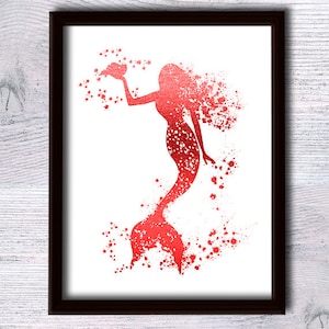May include: Red foil mermaid silhouette with a seashell in her hand, surrounded by red splatter paint on a white background.