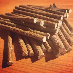 May include: A pile of brown sticks, likely for crafts or a fire starter.