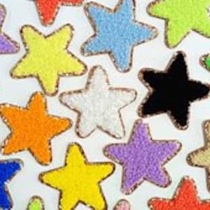 May include: Assortment of colorful star-shaped fabric patches with a gold trim. The patches are made of various materials, including sequins, beads, and felt.