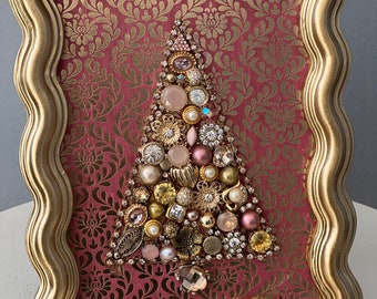 Christmas tree created from mauve, gold and rhinestone vintage to modern jewelry framed in contemporary gold 4 1/2 x 6 1/2” frame.