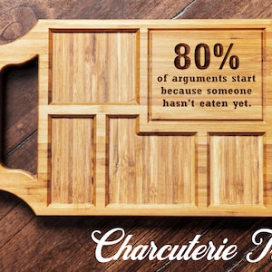 May include: A wooden charcuterie tray with a handle and multiple compartments. The tray has an engraved saying: "80% of arguments start because someone hasn't eaten yet."
