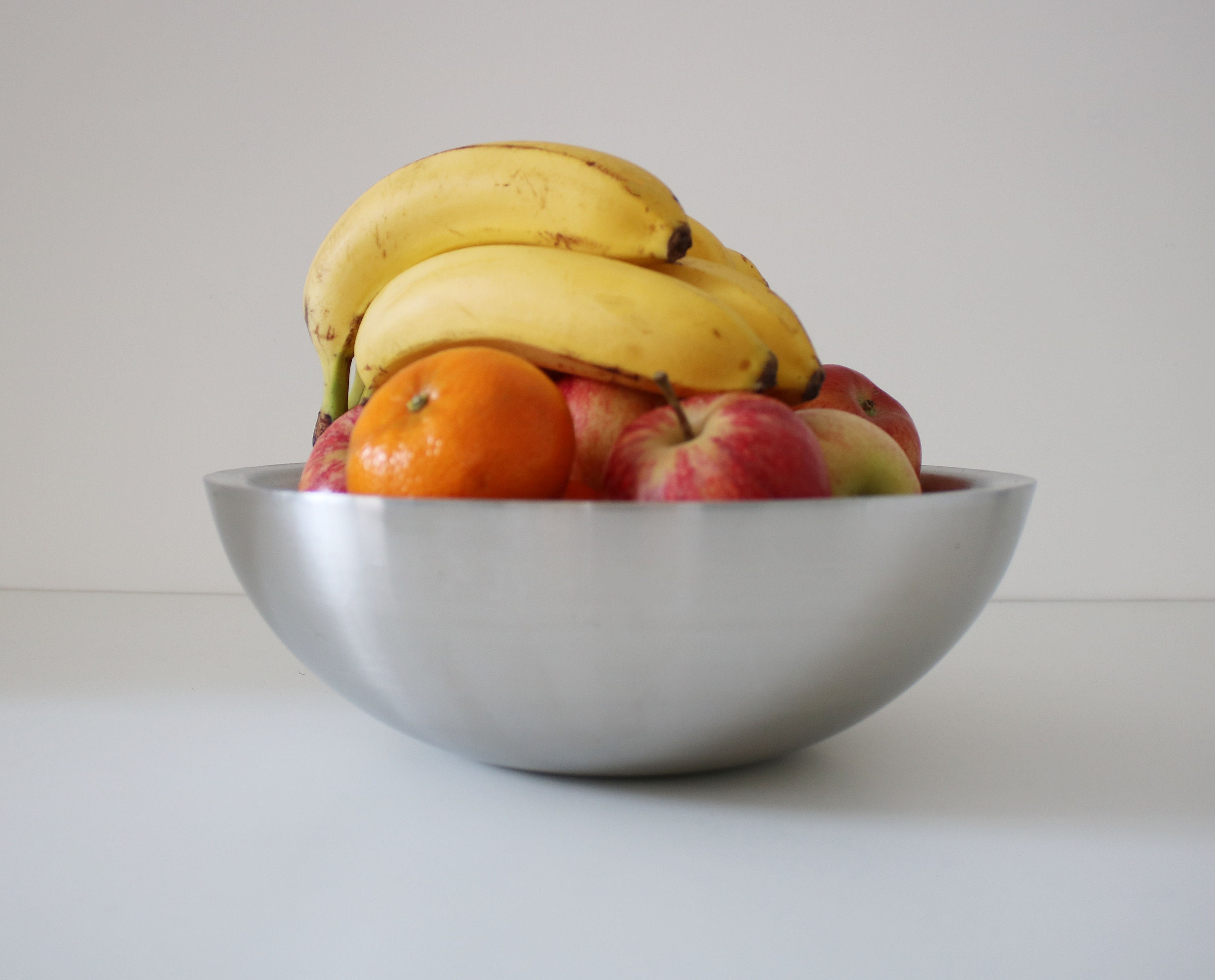 Modernist brushed stainless steel hollow fruit / serving bowl late