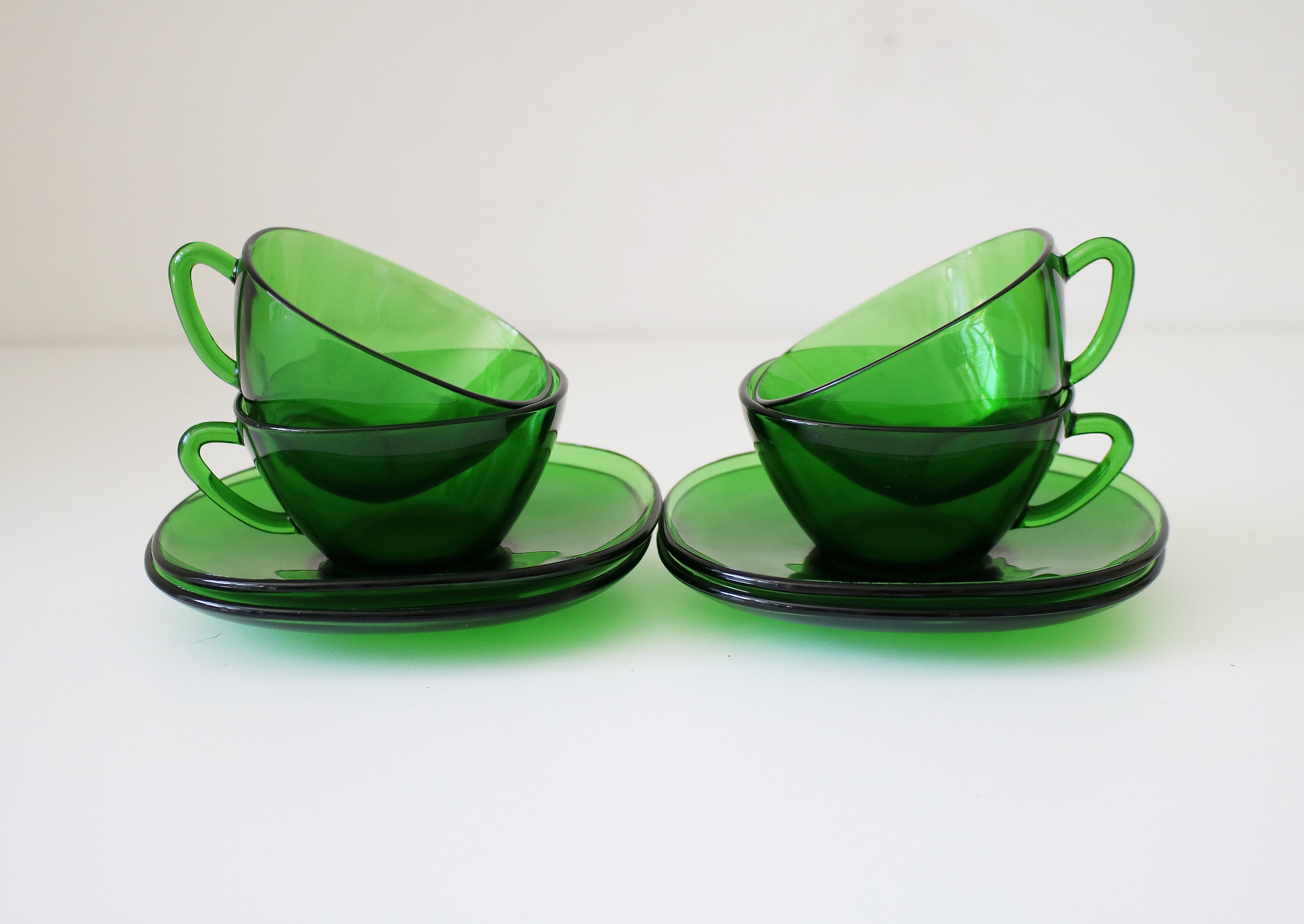 Set of 4 1970s green glass cups and saucers by Vereco of France small
