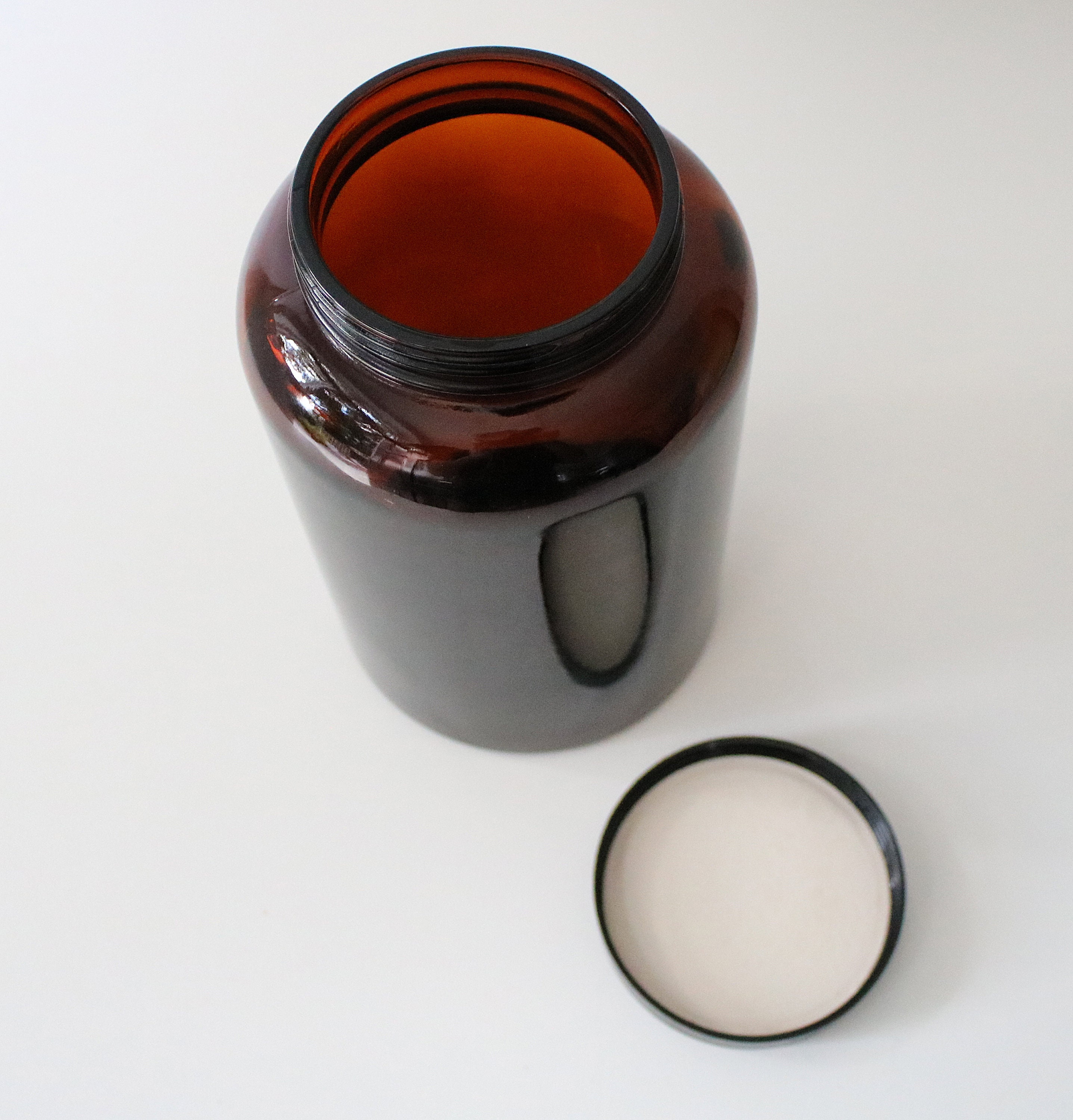 Large 1970s brown / amber glass jar with black screwtop lid Biba