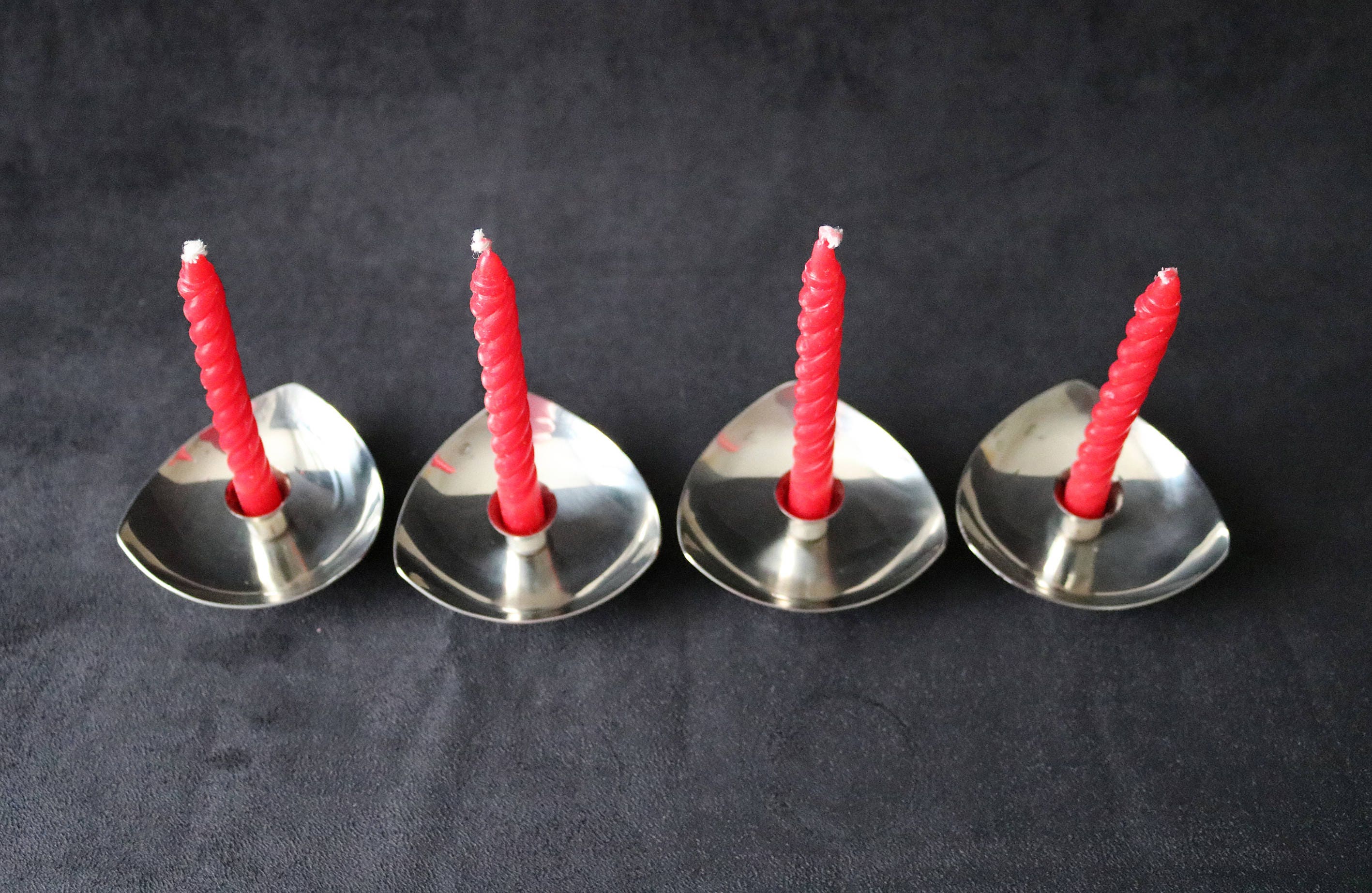 Set of 4 mid century Danish stainless steel candle holders