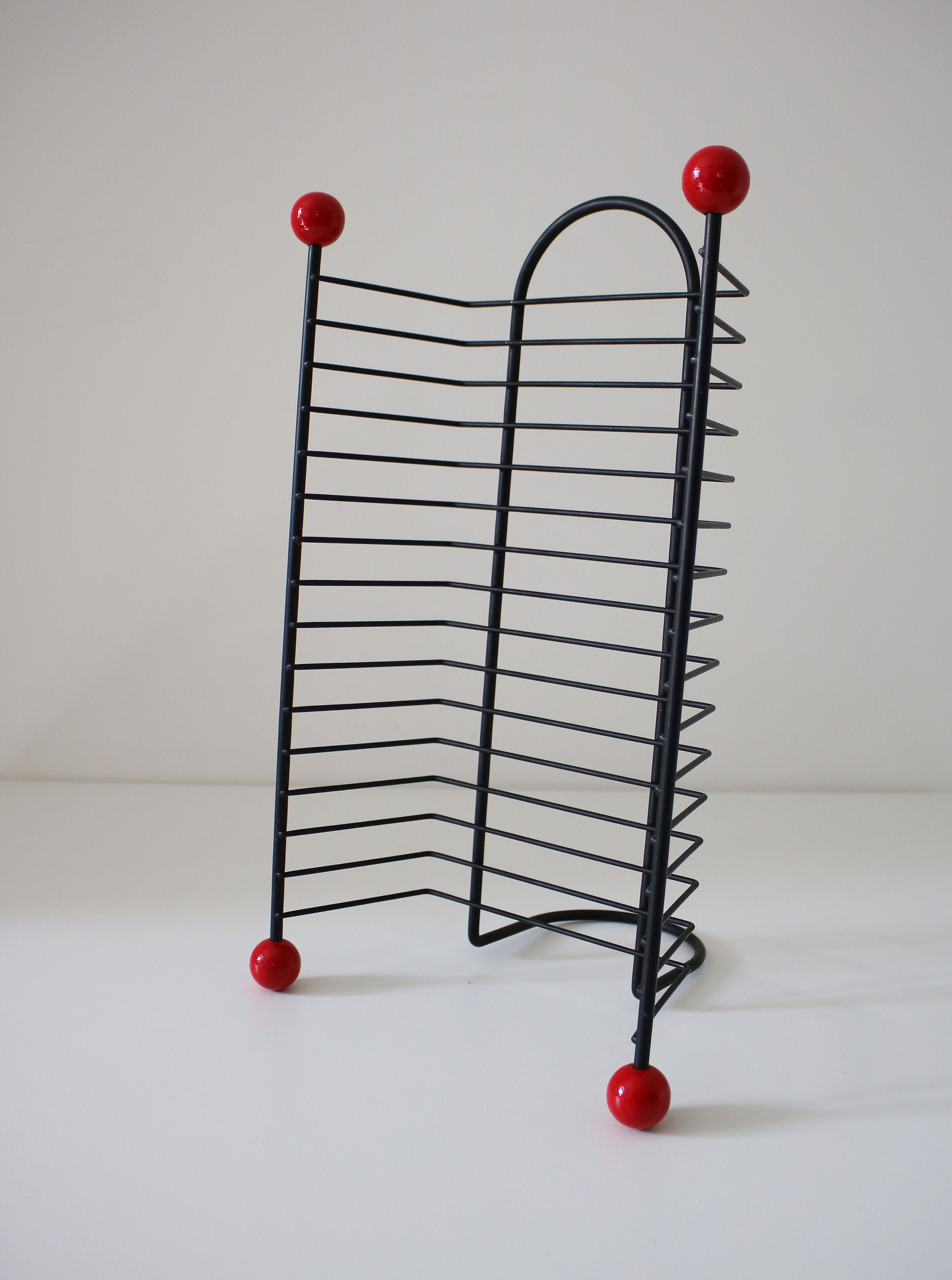1980s 50s revival DVD rack black wire metal with atomic red bobbles