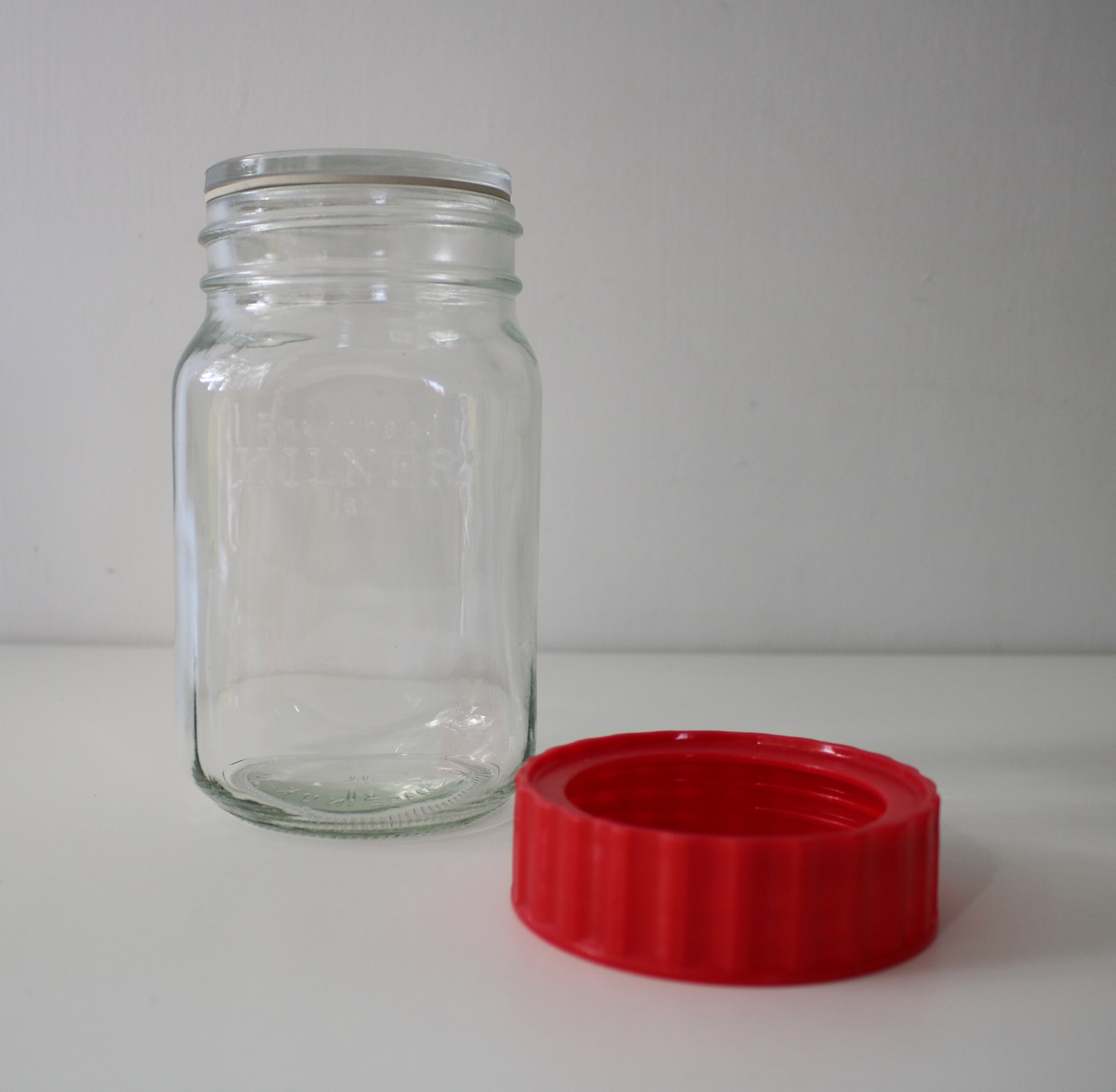 Pair of red Ravenhead Kilner jars 1 litre