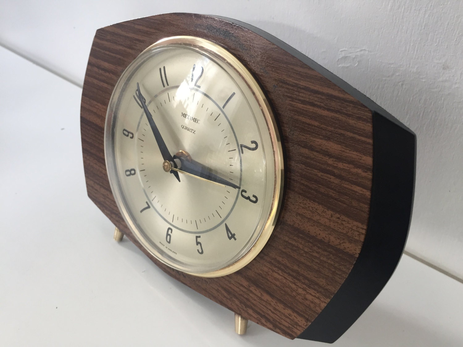 Mid century Metamec battery operated clock teak laminate and brass