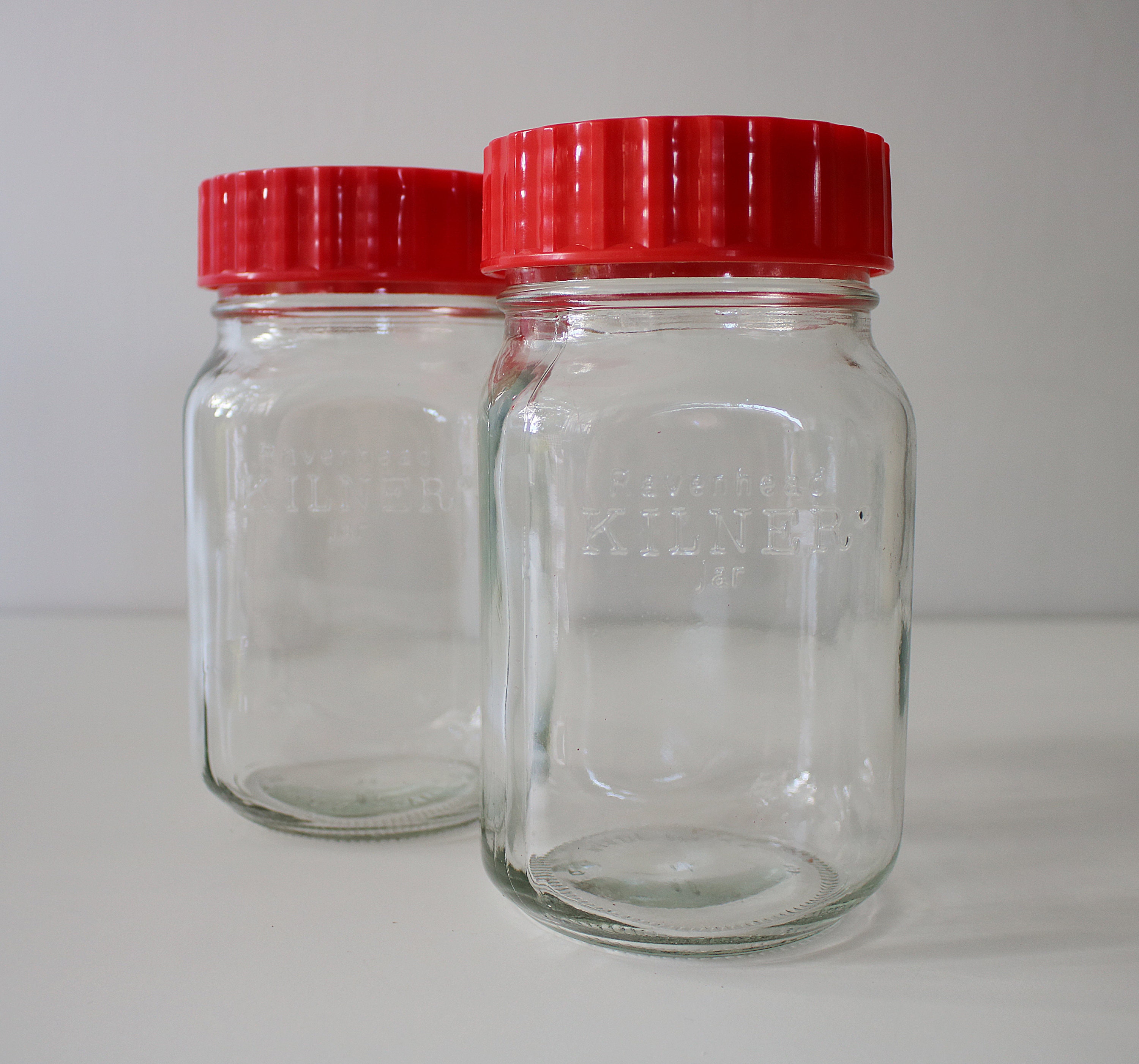 Pair of red Ravenhead Kilner jars 1 litre