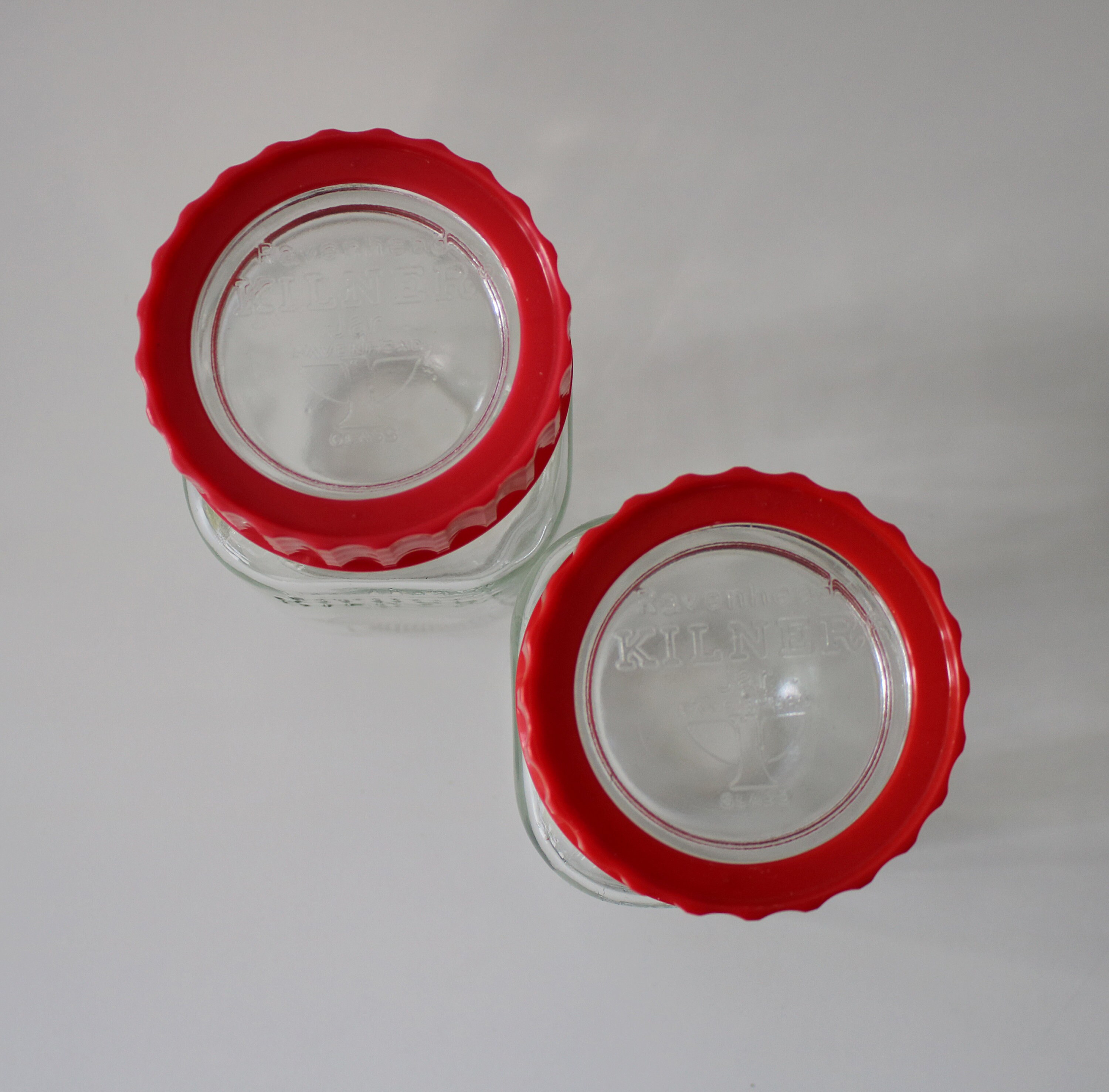 Pair of red Ravenhead Kilner jars 1 litre