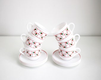 Six 1980s red, white and green milk glass cups and saucers by Arcopal France
