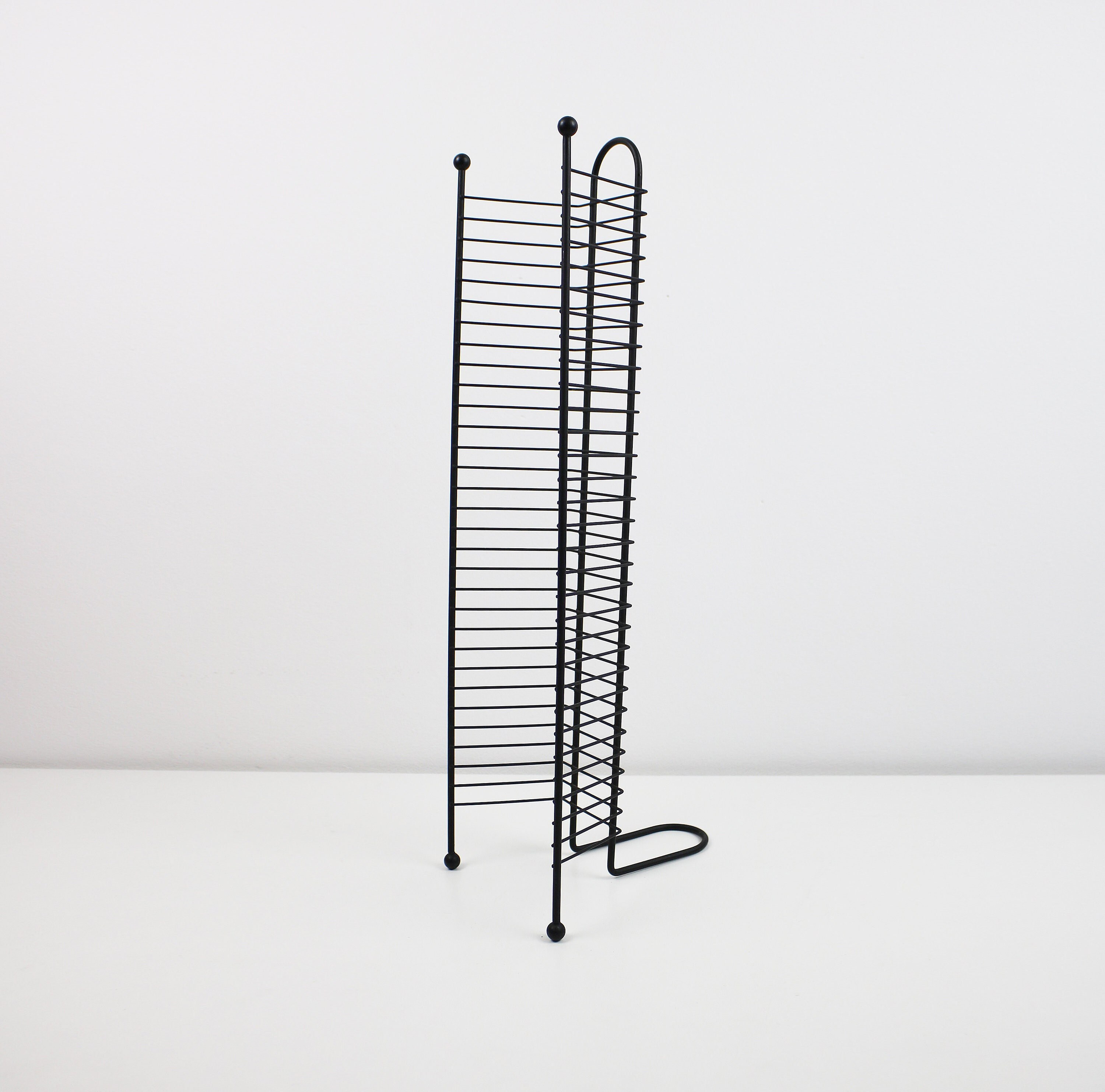1980s / 90s CD tower / rack in black metal with bobble feet