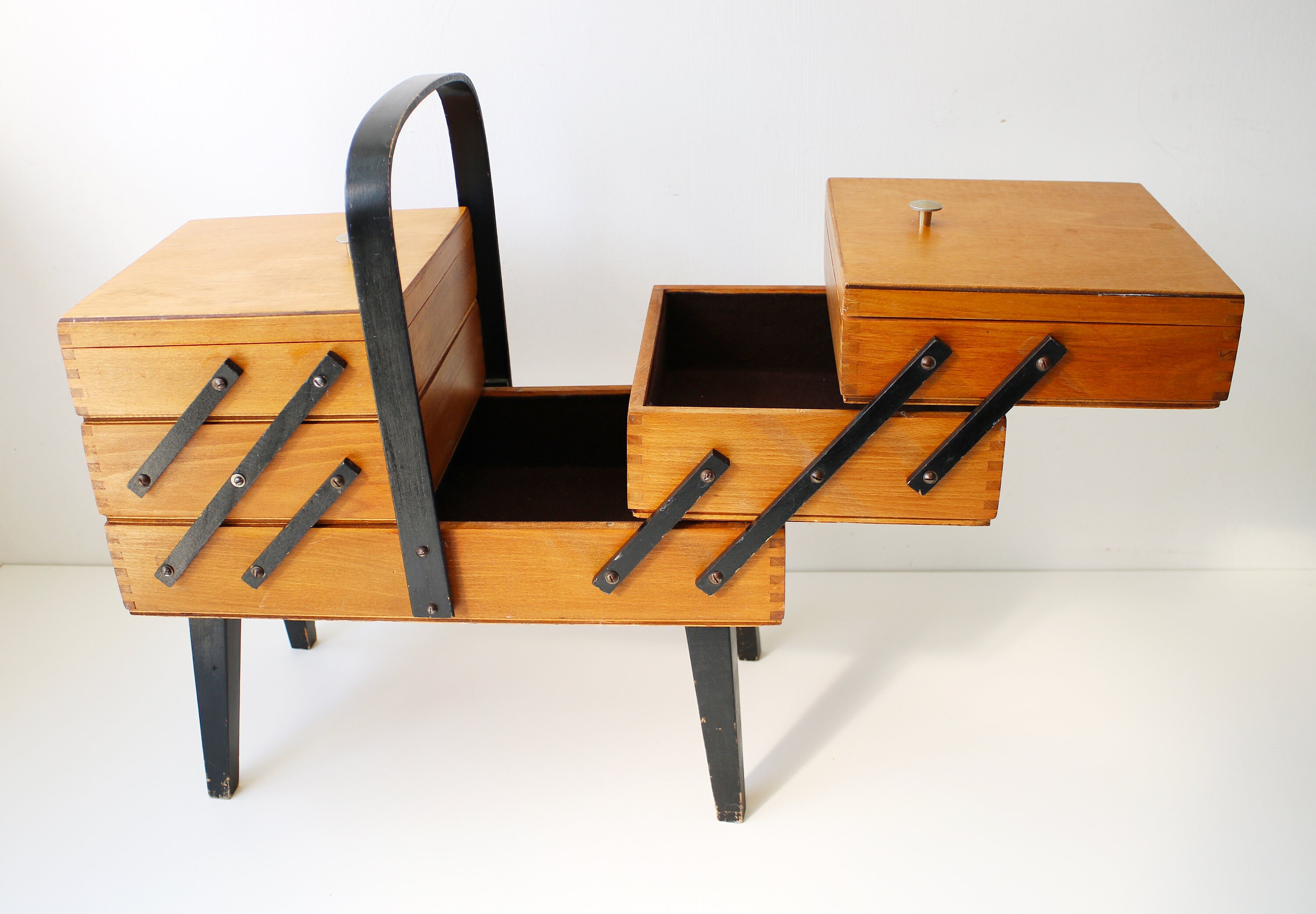 Mid century wooden cantilever sewing or jewellery craft storage box on legs