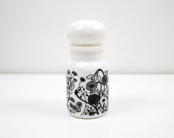 Floral black and white milk glass apothecary jar / storage canister made in Belgium