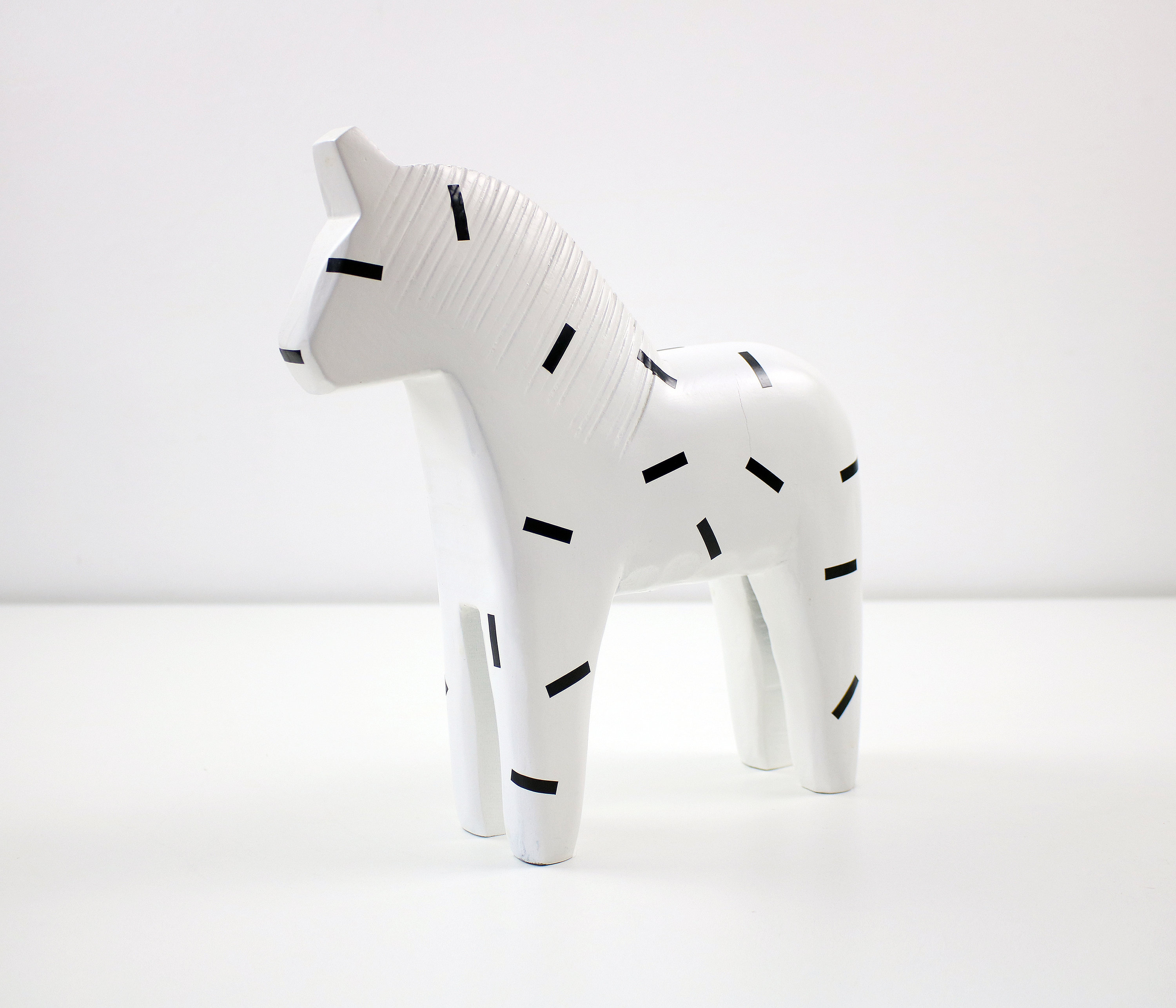 1999 white with black pattern wooden Dala horse for Ikea Finansiell