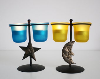 Pair of 1990s sun and moon / astral black metal and glass tealight holders / posy vases - yellow and blue