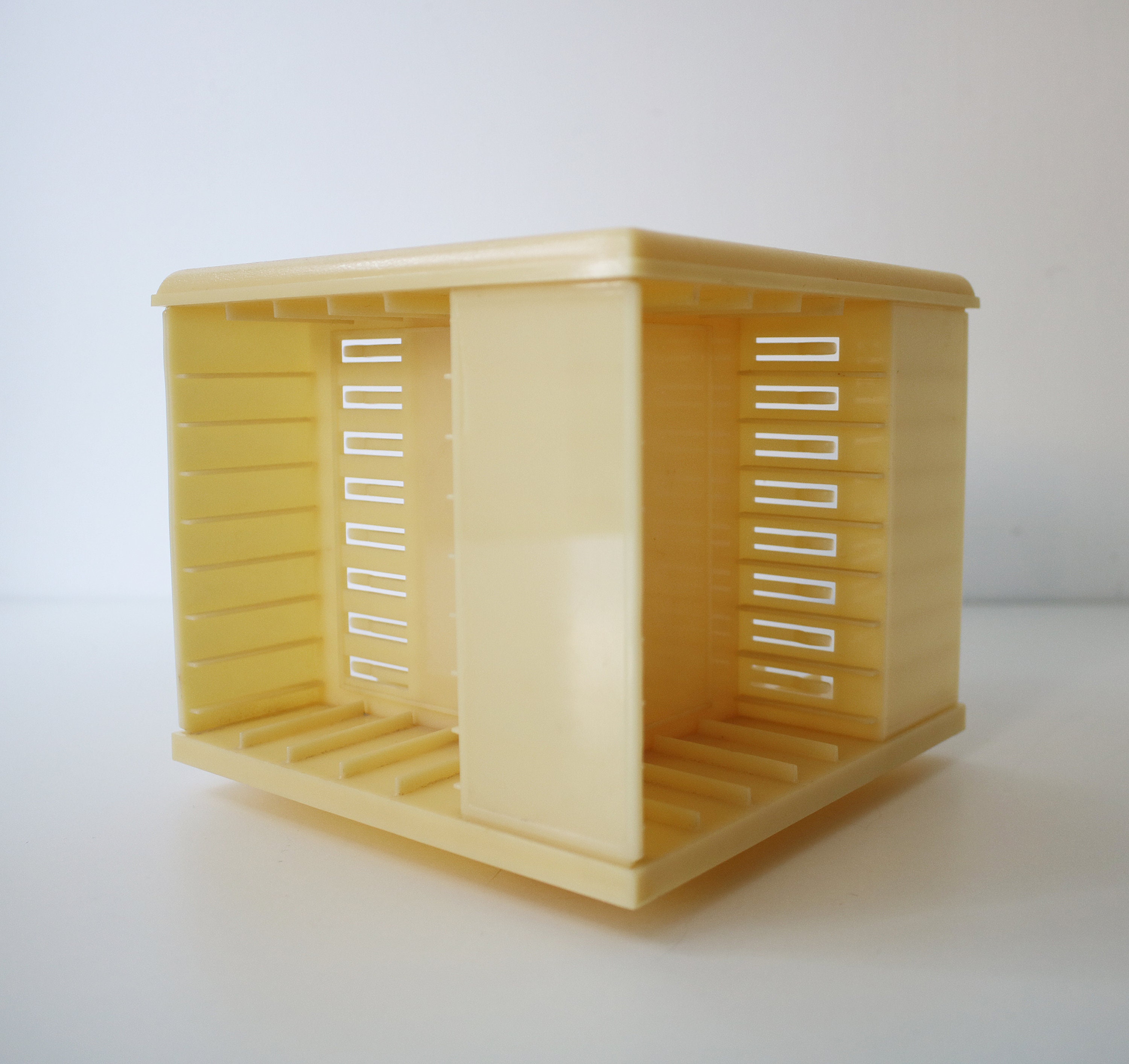 Rotating audio cassette tape storage holder rack in cream plastic