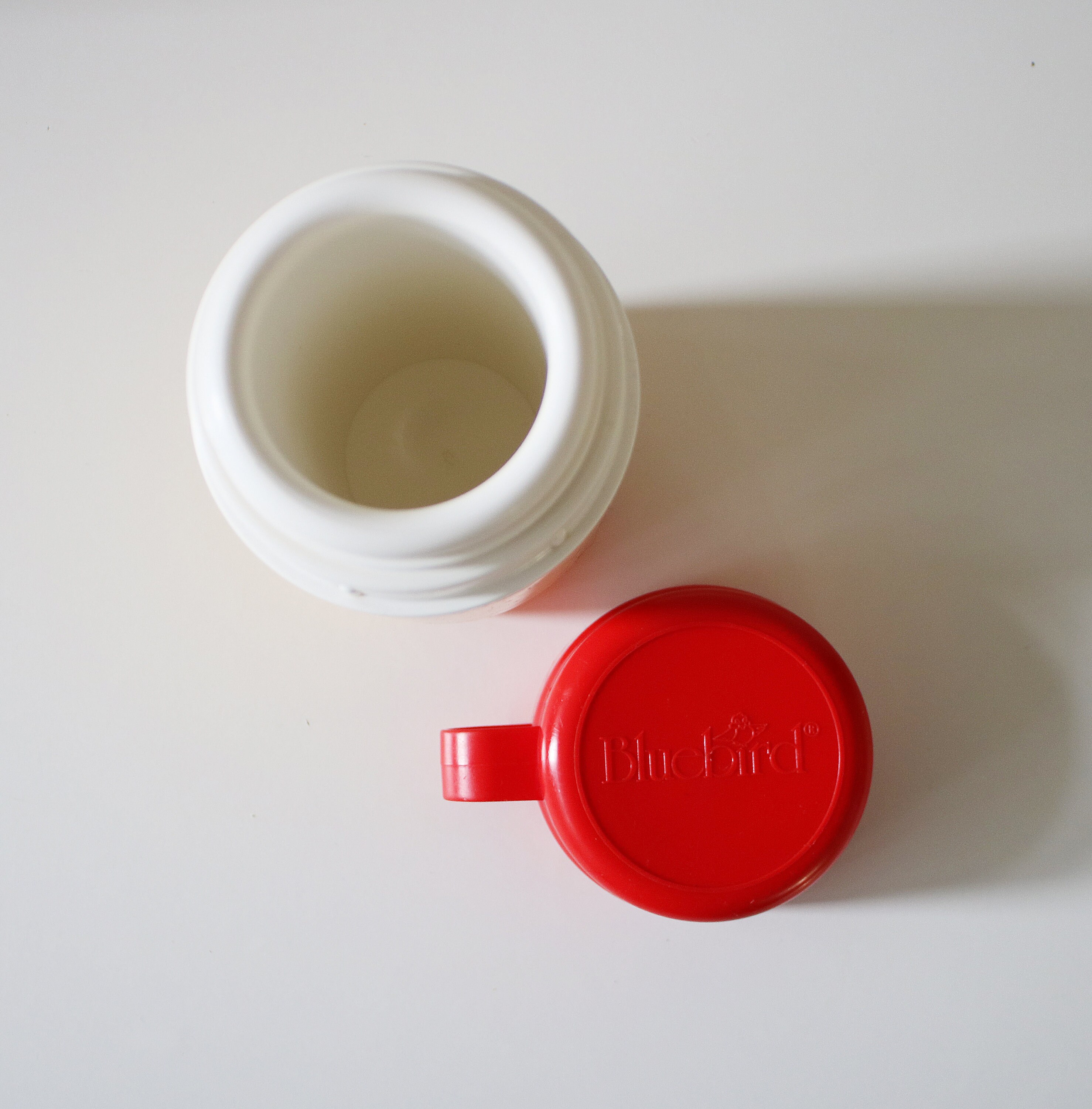 1980s flask by Bluebird Toys in bright yellow and red plastic