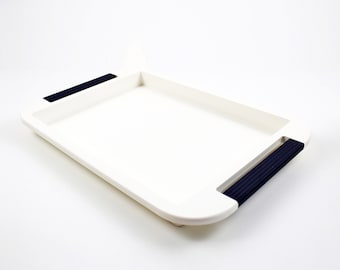 Estee Lauder space age tray in white acrylic with dark blue handles