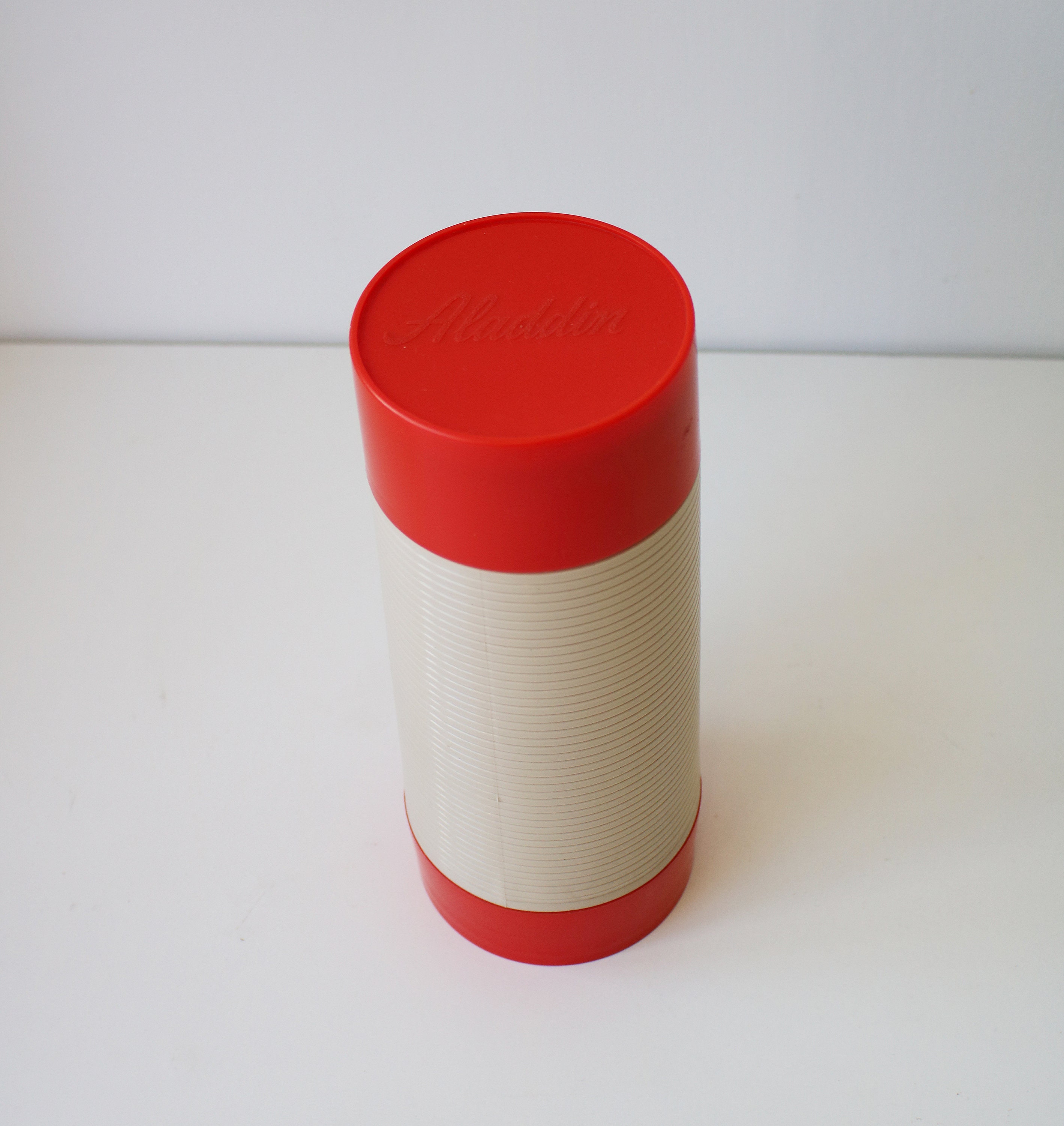 Large 1 litre orange and beige Aladdin food flask.