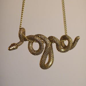 WADJET* Sacred knotted snake brass pendant. Unisex boho necklace