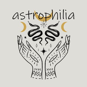 May include: Black and gold illustration of two hands holding a pair of snakes intertwined with a crescent moon and stars. The text "astrophilia" is written above the hands.